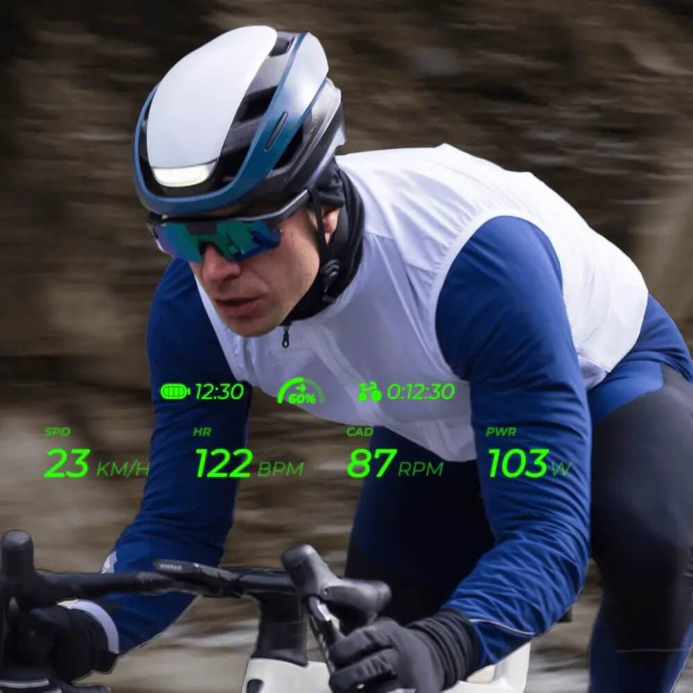 A cyclist using the Cybersight ZENITH smart eyewear with an integrated heads-up display showing performance data.