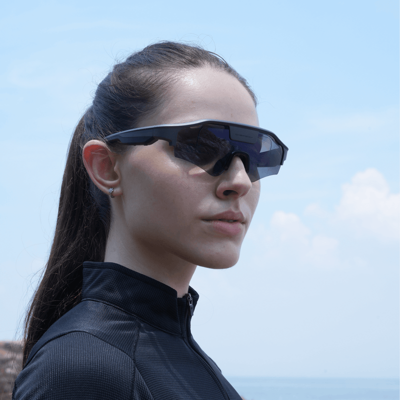 Woman wearing CYBERSIGHT ZENITH with a clear blue sky background